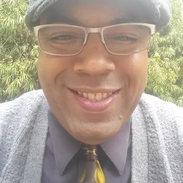Dr. David T. Randolph wearing a flat cap