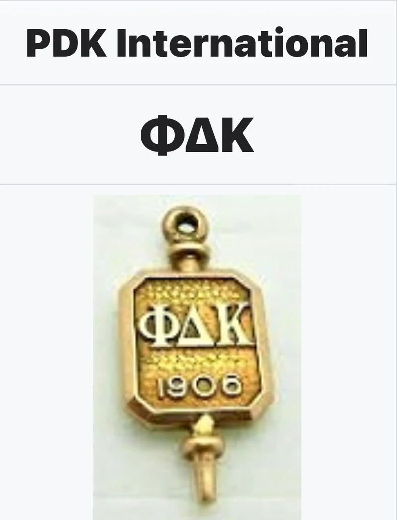 Phi Delta Kappa membership pin bearing the founding year, 1906
