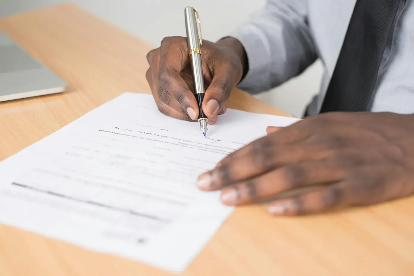 Male signer completing notarial form