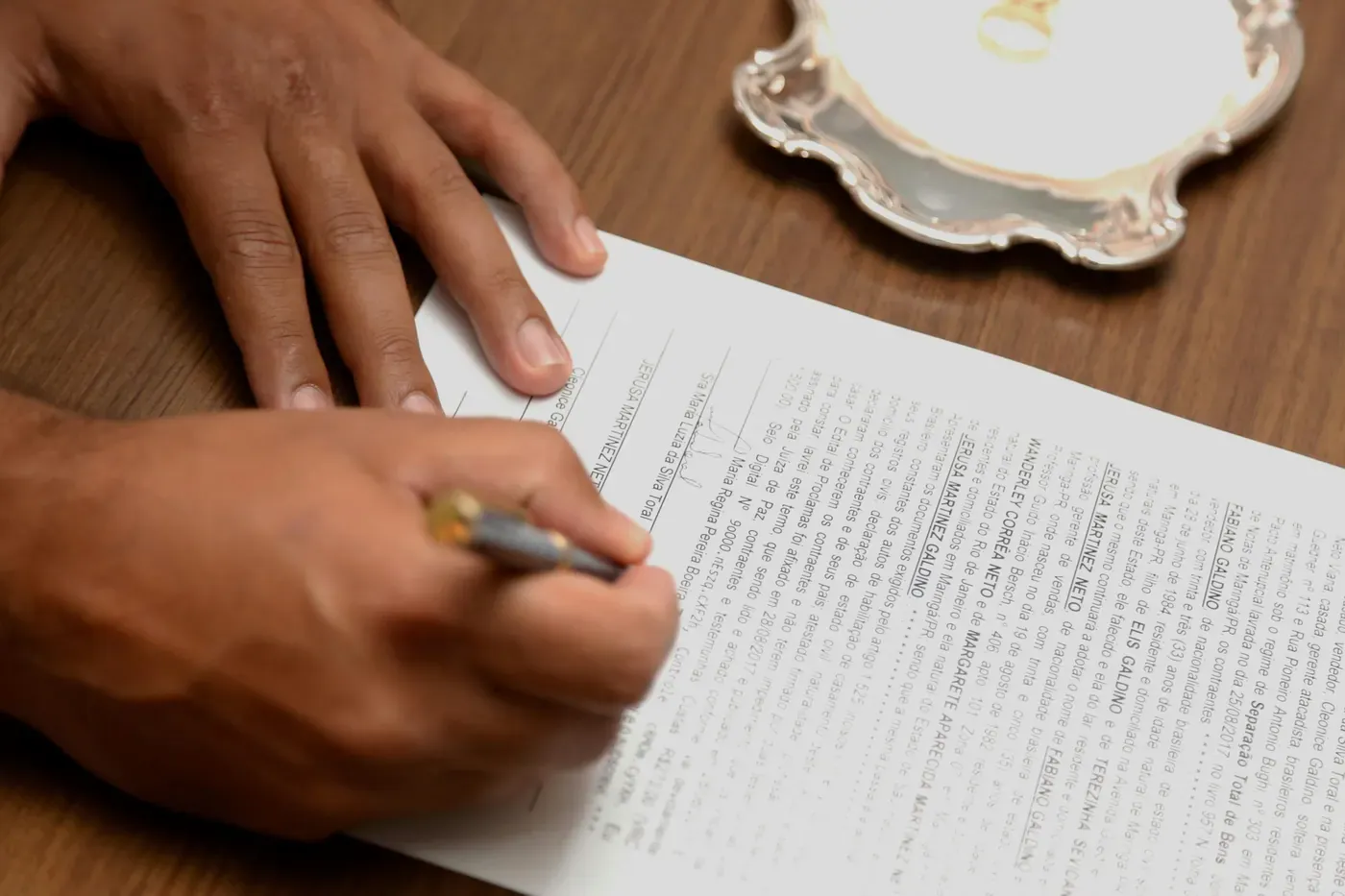Witness signature on tray with seal