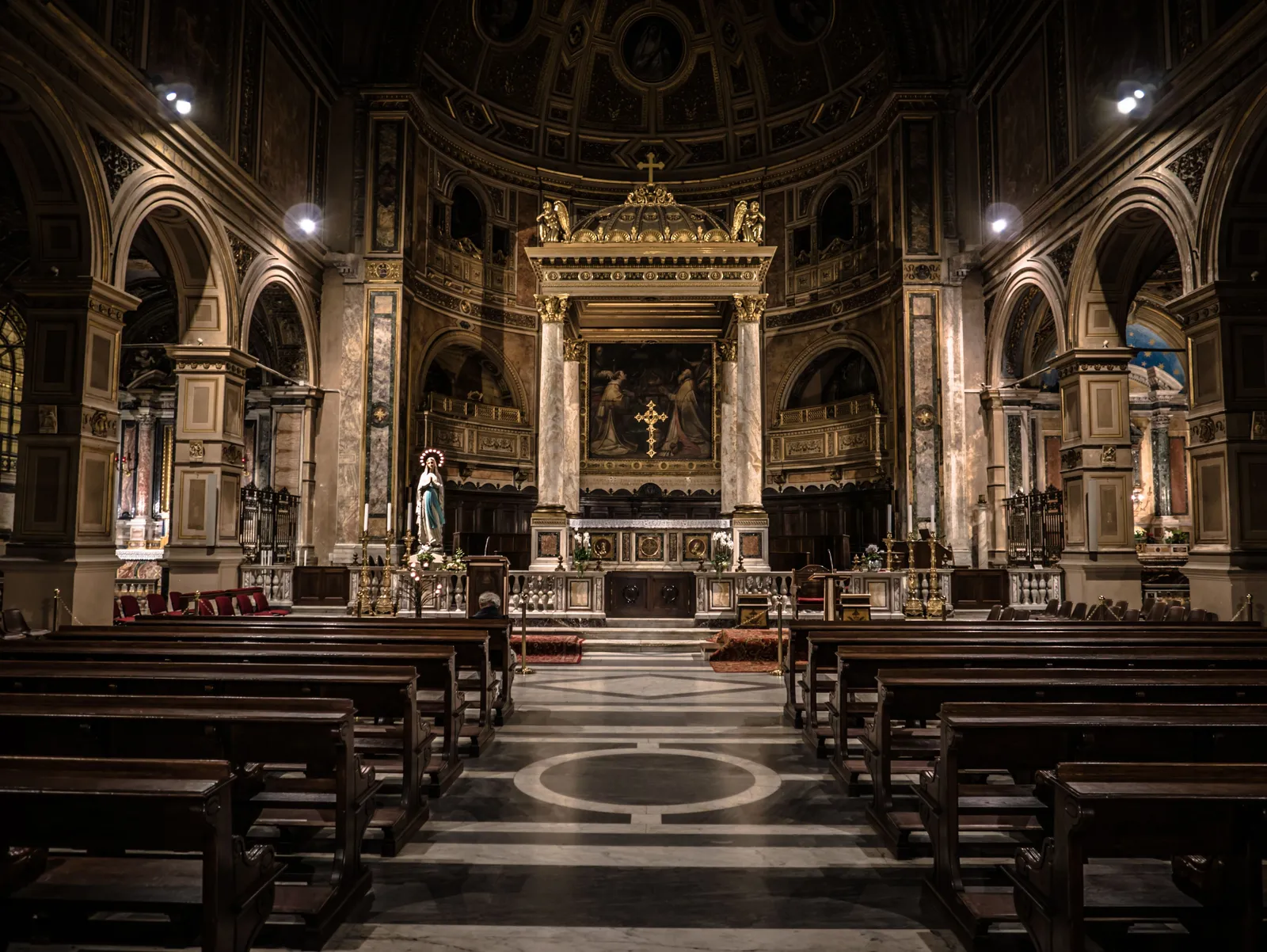 The long nave of a basilica receding toward the sanctuary.
